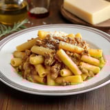 A plate of pasta with meat sauce.
