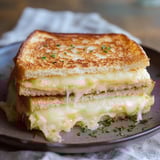 A sandwich on a plate.