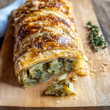 A pastry on a wooden board.